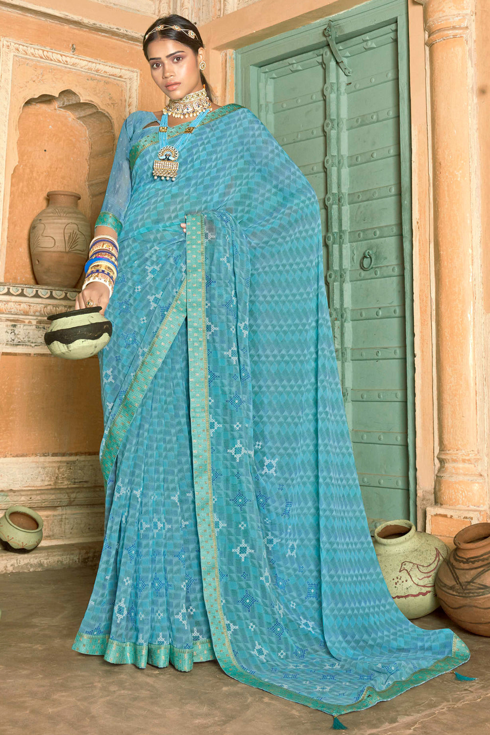 Sky blue color soft georgette saree with zari weaving work