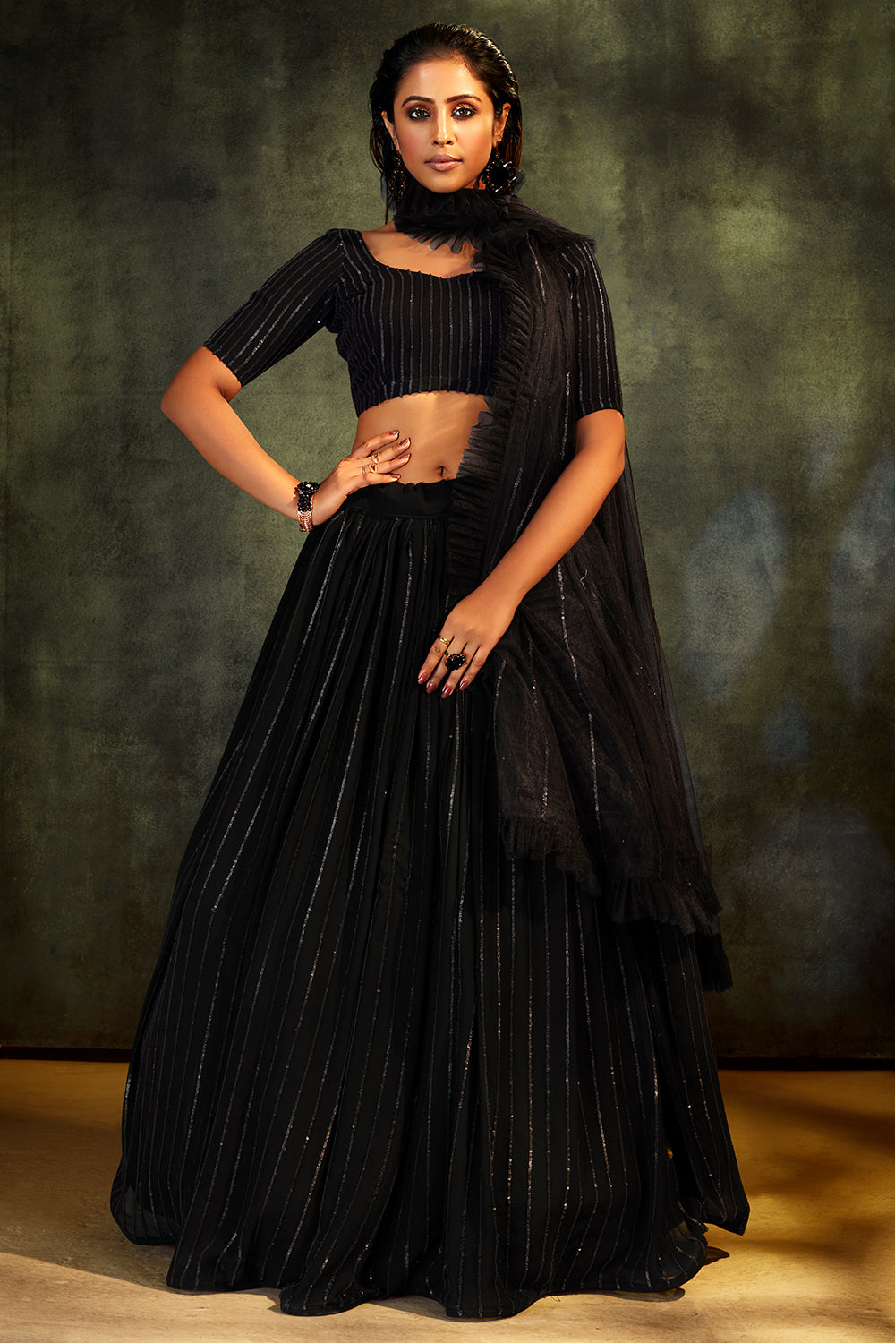 INK BLACK PRE STITCHED LEHENGA SAREE AND EMBROIDERED CHOLI WITH CUT OUT  BACK, GOLD DETAILS AND TASSELS - Seasons India