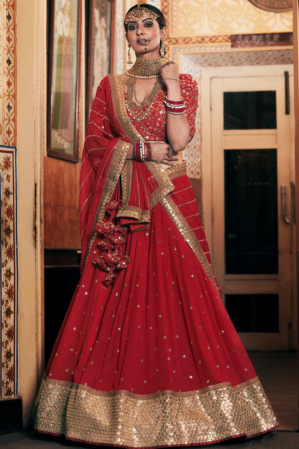 Photo of red lehenga saree with sheet gold sequinned dupatta